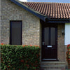 Entrance of a brick house with a dark wooden door,  20% VLT static cling tinted windows, and surrounding hedge.